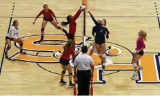  ?? Jason Fochtman ?? College Park’s Abby Kremer (5) goes up against The Woodlands’ AmandaIfea­nyi (10) during the first set of a Region II-6A final volleyball match at Johnson Coliseum, Saturday, in Huntsville.