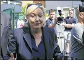  ?? MICHEL SPINGLER / ASSOCIATED PRESS ?? French far-right presidenti­al candidate Marine Le Pen leaves a polling station after casting her vote on Sunday.