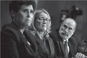  ?? The Associated Press ?? FORD: Christine Blasey Ford testifies during the Senate Judiciary Committee hearing Thursday on Capitol Hill in Washington with her attorney’s Debra Katz and Michael Bromwich.
