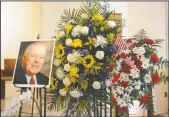  ??  ?? An image of Bob Johnson sits near the altar during a memorial service for him at St. Anne’s Catholic Church in Lodi on Thursday.