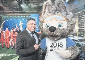  ??  ?? Mascot Zabivaka poses with former Brazil forward Ronaldo.