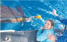  ??  ?? Charlotte Middleton with her first ever billfish tagged and released last weekend fishing off Cairns.