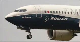  ?? ELAINE THOMPSON — THE ASSOCIATED PRESS ?? A Boeing 737Max jet prepares to land at Boeing Field following a test flight in Seattle in 2020. Air India is placing an order for 190the aircraft and 30of two other Boeing models at a cost of $34million.