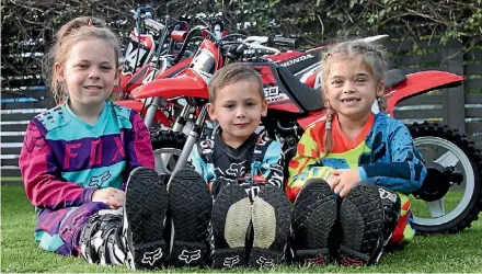  ?? REXINE HAWES ?? Siblings, Penny, Percy and Hazel, are all passionate about mini motocross.