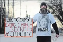  ?? DAVE JOHNSON THE WELLAND TRIBUNE ?? William O’Sullivan holds a sign out in front of St. Kevin’s Catholic church in Welland this past Sunday. O’Sullivan, who was abused by former Roman Catholic priest Donald Grecco, has been protesting out front of the church on Niagara Street for the past 12 weeks.