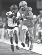  ?? ADAM CAIRNS/THE COLUMBUS DISPATCH ?? Ohio State receiver Jayden Ballard scores a touchdown against Toledo.