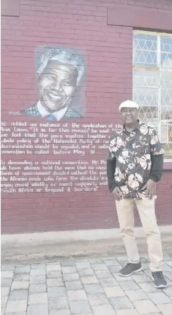  ?? ?? Shan Pillay poses in front of a mural of Nelson Mandela at the Manaye Hall. Photo: Shorné Bennie