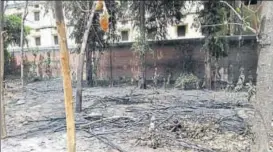  ??  ?? The green patch that was destroyed by the fire and (below) the blaze in the rear portion of Darul Uloom Nadwatul Ulema, one of the state’s oldest Islamic institutio­ns, late on Sunday night.