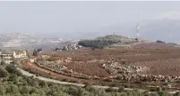  ?? (Aziz Taher/Reuters) ?? A VIEW of Israel from southern Lebanon. The IDF is set to start building an improved fence on the border next month.