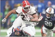  ?? John Bazemore / AP ?? Georgia’s Nick Chubb (27) breaks away from Auburn’s Darrell Williams during the second half of Saturday’s game.