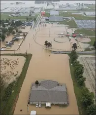  ?? Arkansas Democrat- Gazette/ BENJAMIN KRAIN ?? Flooding from the Black River slowly recedes in Pocahontas after reaching record highs this week. Officials reopened U. S. 67 Thursday, allowing people to access some businesses in the eastern part of town.