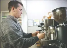  ?? BEA AHBECK/NEWS-SENTINEL ?? Manager Nick Coffman makes a latte for a customer at the new coffee shop Inspire Coffee on Pine Street in Downtown Lodi on Tuesday.