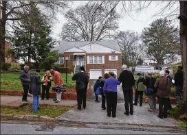  ?? HYOSUB SHIN / HSHIN@AJC.COM ?? Members of the press view the house, where Martin Luther King Jr. lived at the time of his assassinat­ion, during Civil Rights Tours Atlanta in March 2015. The more personal version of King people know, the more they understand his mission and the...