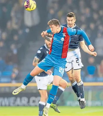  ?? ?? Nathan Shaw of Inverness Caledonian Thistle competes with Dundee’s Cammy Kerr in the air to win a loose ball.