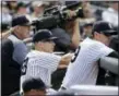  ?? FRANK FRANKLIN II — THE ASSOCIATED PRESS ?? Yankees manager Joe Girardi, center, watches Tyler Clippard pitch in the ninth inning Saturday.