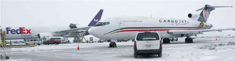  ?? SUPPLIED ?? Edmonton Internatio­nal Airport’s new state-of-the-art Cargo Village facility makes loading and unloading these Cargojet and FedEx planes more efficient.