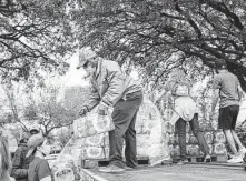  ?? Brian Barr / Courtesy ?? Mutual aid volunteers unload water at Finnigan Park during last month’s freeze. A Feb. 17 distributi­on ran out in 30 minutes.