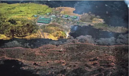  ?? L.E. BASKOW/AP ?? Lava from the Kilauea volcano flows near the Puna Geothermal Venture power plant Sunday in Hawaii.