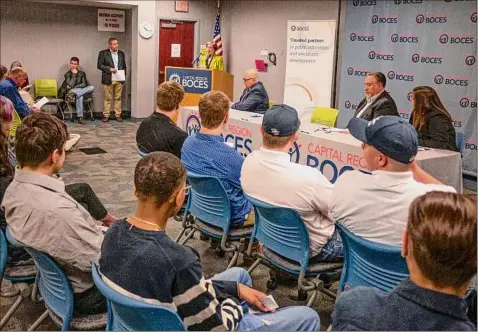  ?? Paul Buckowski / Times Union ?? Roberta Reardon, background at podium, commission­er of New York State Department of Labor, speaks at the National Signing Day ceremony at Capital Region BOCES on Thursday in Latham.