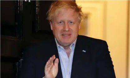  ?? Photograph: Pippa Fowles/Crown Copyright/10 Downing Street/PA ?? Boris Johnson clapping for Britain’s carers outside 11 Downing Street in London last week as he self isolated with coronaviru­s.