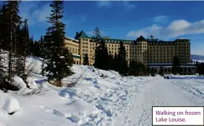  ??  ?? Walking on frozen Lake Louise.