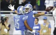  ?? REY DEL RIO — THE ASSOCIATED PRESS FILE ?? Detroit Lions wide receiver Golden Tate, left, here congratula­ting fellow receiver Marvin Jones on Sunday after a Jones touchdown catch, is now the property of the Eagles after the team spent a third-round draft choice Tuesday to acquire Tate from the Lions.