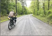  ?? Courtesy photo ?? Brannon Pack meanders along a back-country road. He organized the trip and mapped out the route, mostly on gravel roads, from Springdale to Memphis.