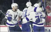  ?? GERRY BROOME — THE ASSOCIATED PRESS ?? Tampa Bay’s Victor Hedman (77) and Pat Maroon (14) congratula­te Ross Colton following Colton’s goal.