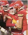  ?? JEFF ROBERSON/AP ?? Chiefs quarterbac­k Patrick Mahomes is helped by teammates during the second half of Saturday’s game in Kansas City, Mo.