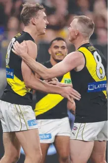  ?? Picture: Getty Images ?? Tigers teammates Tom Lynch and Jack Riewoldt celebrate a goal last year.