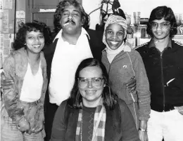 ??  ?? Farook Khan with Post staff in the 1980s.