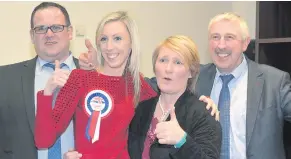  ??  ?? Carla Lockhart celebratin­g her election result with her husband, Rodney Condell, left, and her parents Valerie and Kenneth Lockhart