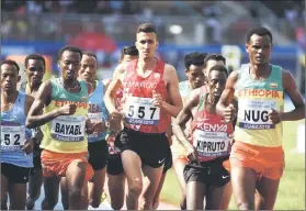  ??  ?? Moroccan Bakkali Soufianne (centre) runs to place first in the men’s 3000 metre Steeplecha­se final at the ongoing Africa Athletics Championsh­ip at the Stephen Keshi Stadium in Asaba, Delta State in Midwestern Nigeria. — AFP photo
