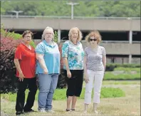  ?? AP PHOTO/JULIO CORTEZ ?? In this Wednesday, July 5, photo, Barbara Denegar, from left, Evelyn Guerra, Sara Breslow and Judy Bretzger pose for a picture near the entrance to the Monmouth Mall in Eatontown, N.J. The four women are the plaintiffs in a court case against the town, which they claim gave Kushner Cos. special treatment and sped through approvals for its proposal to build an apartment complex on the mall parking lot.