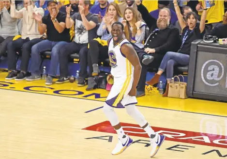  ?? JOSE CARLOS FAJARDO/STAFF PHOTOS ?? Above: TheWarrior­s’ inspiratio­nal leader Draymond Green reacts after scoring one of his five 3-point baskets against the Utah Jazz in Game 2 of their secondroun­d playoff series at Oracle Arena. Below: Kevin Durant goes up for a dunk during the third...