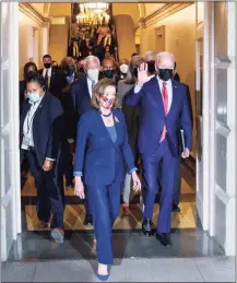  ?? J. Scott Applewhite / Associated Press ?? Speaker of the House Nancy Pelosi, D-Calif., and President Joe Biden arrive to meet Friday with House Democrats to rescue his social and economic agenda that has been threatened by the progressiv­e wing of the party.