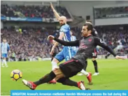  ?? — AFP ?? BRIGHTON: Arsenal’s Armenian midfielder Henrikh Mkhitaryan crosses the ball during the English Premier League football match between Brighton and Hove Albion and Arsenal at the American Express Community Stadium in Brighton, southern England yesterday.