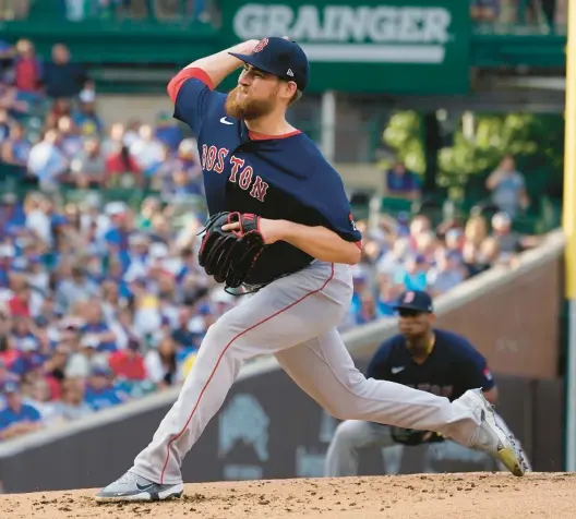  ?? NAM Y. HUH/AP ?? Boston Red Sox pitcher Josh Winckowski throws against the Cubs during the first inning Saturday at Wrigley Field.