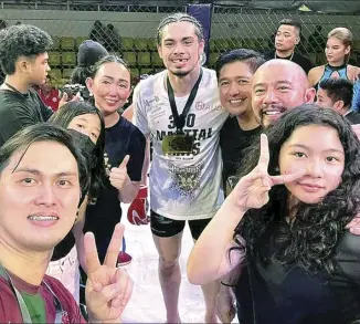  ?? CONTRIBUTE­D PHOTO ?? Fil-Swiss mixed martial artist Chris Hofmann celebrates after beating Kim Min Seok of South Korea by second round TKO in the main event of “Bloodline:URCC 83 Heritage Fight” over the weekend at the Zamboanga del Norte Cultural and Sports Center. Hofmann is joined by Dapitan City Mayor Seth Frederick “Bullet” Jalosjos and Kat Hamoy of Dapitan Heritage and Arts Council.