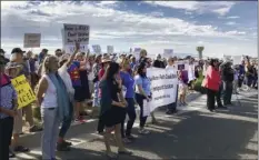  ??  ?? Demonstrat­ors rally in support of Iraqi refugee Kadhim Al-bumohammed outside of Immigratio­n and Customs Enforcemen­t offices in Albuquerqu­e on Thursday. AP PHOTO/RUSSELL CONTRERAS