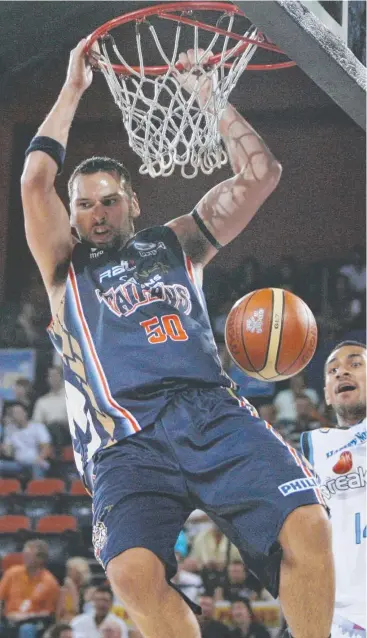  ??  ?? HE’S BACK: Bruising centre Matt Smith, here in action for the Cairns Taipans in 2006, has come out of retirement in career-best form to play with the Cairns Marlins.
