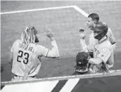  ?? K.C. ALFRED U-T ?? Wil Myers (helmet) celebrates with Fernando Tatis Jr. after scoring in the fourth inning.