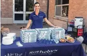  ??  ?? The middle school rugby players appreciate­d the pizza, but the cowbells were the big win in Martha Turner Sotheby’s Internatio­nal Realty’s agent Angela Longo’s recent team support.