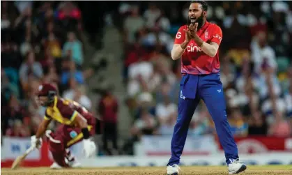  ?? ?? Adil Rashid reached a personal milestone of 100 T20 internatio­nal wickets in England’s defeat against West Indies. Photograph: Ricardo Mazalán/AP