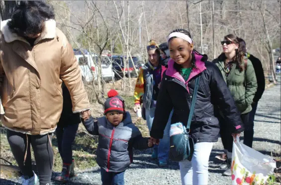  ?? MEDIANEWS GROUP FILE PHOTO ?? A family walks along the trail at the Althouse Arboretum in Upper Pottsgrove. Walking briskly is a heart healthy activity that can help the environmen­t when used as a form of transporta­tion.