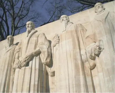  ??  ?? 0 John Knox, far right, stands with John Calvin, second left, in this monument to the Reformatio­n in Geneva