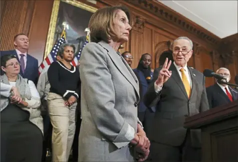  ?? Win McNamee/Getty Images ?? Speaker of the House Nancy Pelosi and Senate Democratic Leader Chuck Schumer speak at an event with federal government employees who asked for an end to the partial shutdown of the U.S. government Wednesday on Capitol Hill. The government shutdown is now in its third week.