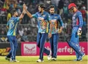  ?? (AFP) ?? Sri Lanka's Kasun Rajitha (2L) celebrates after taking the wicket of Afghanista­n's Mujeeb Ur Rahman (R) on Sunday
