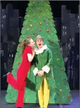  ?? Photo provided ?? Musical: Jovie (left), played by Hannah Hickman, gives Buddy, played by Clay Evers, a quick kiss on the cheek in front of the Rockefelle­r Center Christmas Tree during “Elf The Musical JR.”