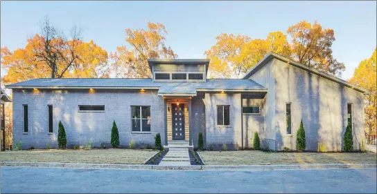  ?? SUBMITTED PHOTOS ?? In addition to four bedrooms and three baths, this Little Rock home offers an abundance of natural light and views of the Arkansas River.